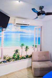 a living room with a view of the beach at Autentico y Lindo Departamento in Puerto Vallarta