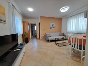 a living room with a couch and a table at Apartman Petra in Zadar