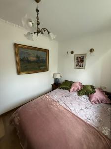 Postel nebo postele na pokoji v ubytování Apartament Antique Pruszków Centrum