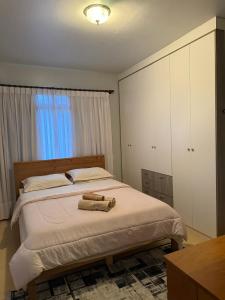 Ένα ή περισσότερα κρεβάτια σε δωμάτιο στο Apartamento família no centro de Pomerode