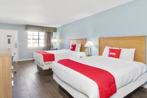 Postel nebo postele na pokoji v ubytování OYO Hotel Ingleside TX