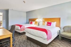 Postel nebo postele na pokoji v ubytování OYO Hotel Ingleside TX