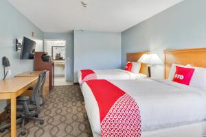 Postel nebo postele na pokoji v ubytování OYO Hotel Ingleside TX