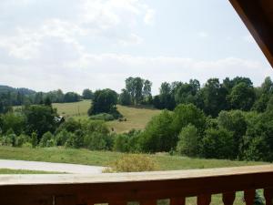 a view of a field from the deck of a house at Cozy Holiday Home in Stupna with Private Garden in Stupná