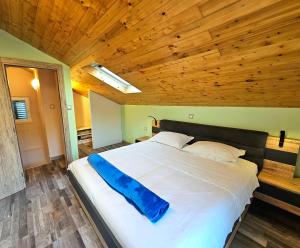 a large bed in a room with a wooden ceiling at Villa Broč in Postira +67 photos