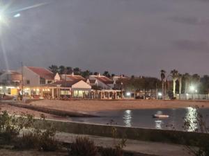 a boat in a body of water at night at Coral Reef in Santa Maria