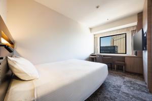 TV a/nebo společenská místnost v ubytování Kawasaki Nikko Hotel