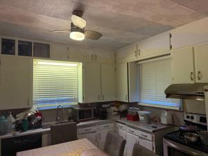 a kitchen with white cabinets and a ceiling at Oshawa Duplex in Oshawa +18 photos