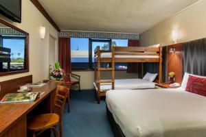 Postel nebo postele na pokoji v ubytování Arkaba Hotel