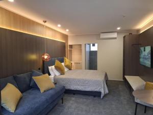 Letto o letti in una camera di Distinction Coachman Hotel, Palmerston North