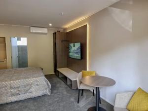 Letto o letti in una camera di Distinction Coachman Hotel, Palmerston North