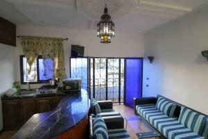 a living room with a couch and a table at Blue Vista 2 in Chefchaouen