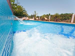 a swimming pool with a water slide at Charming Retreat in Fontanales with Pool in Moya