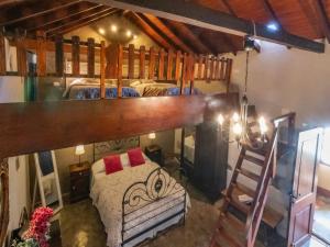 a bedroom with two bunk beds and a ladder at Charming Retreat in Fontanales with Pool in Moya