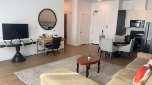 a living room with a couch and a table at Stylish Urban Escape in Downtown Los Angeles in Los Angeles