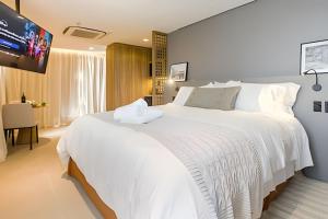 Katil atau katil-katil dalam bilik di Apartamento com Ofurô Vale dos Vinhedos