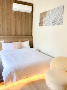 Een bed of bedden in een kamer bij 沙沙民宿