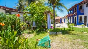 ベラ・クルス・デ・イタパリカにあるCasa de Praia na Ilha - Barra do Poteの家の前庭 +30枚の写真