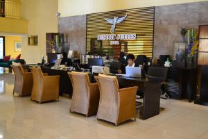 a woman sitting at a table in a restaurant with a laptop at Resort Suites at Bandar Sunway in Petaling Jaya +79 photos