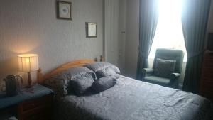 Postel nebo postele na pokoji v ubytování Crawfords Guest house