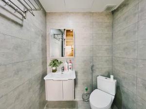 a bathroom with a toilet and a sink at Soin Westlake Apartment in Hanoi +156 photos