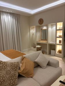 a bedroom with a bed with a clock on the ceiling at Reefy studio 6 in Riyadh