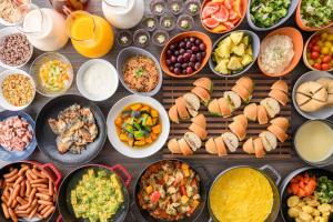 a table topped with lots of different types of food at Via Inn Umeda in Osaka