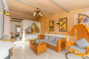 a living room with a couch and a bed at Hangzhou Wei Garden B&B West Lake Branch in Hangzhou