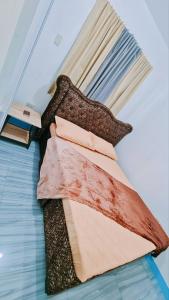 Ένα ή περισσότερα κρεβάτια σε δωμάτιο στο RDRH Guest House