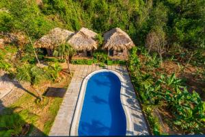 an aerial view of a swimming pool at a resort at Rocky Mountain Homestay Cat Ba in Cat Ba