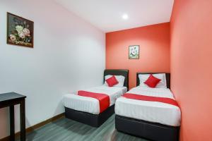 Postel nebo postele na pokoji v ubytování OYO 90282 Hotel Taj Inn, Seksyen 7 + 33 fotografií
