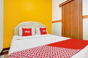 Ένα ή περισσότερα κρεβάτια σε δωμάτιο στο Hotel O Mall Of Indonesia
