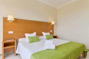 Postel nebo postele na pokoji v ubytování Hotel Amazonas