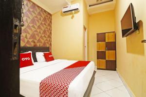 Letto o letti in una camera di Hotel O Papi Inn Guesthouse