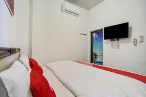Postel nebo postele na pokoji v ubytování OYO 90645 Karisma Residence + 31 fotografií