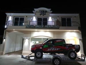 a truck on a trailer in front of a hotelillelevard heinemuseum at Hotel Valle Hermoso in San Agustín de Valle Fértil