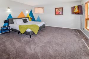 a bedroom with a king sized bed in a room at Sunny Family Home in Denver with huge yard and hot tub in Denver
