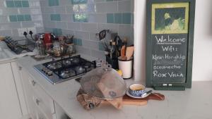 a kitchen counter with a pan on a counter top at Klein-Hangklip Remote Mountain Studio Cottage in Rooiels