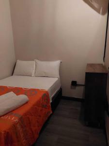 Postel nebo postele na pokoji v ubytování Hostal Machu Picchu Medellín III