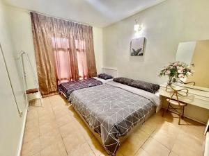 Una cama o camas en una habitación de Mini waterpark Pool BBQ Karaoke Game Station Luxury Villa 40pax A famosa resort Lot 1054 28 fotos más