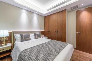 Postel nebo postele na pokoji v ubytování 三亚天成中央海岸海景酒店