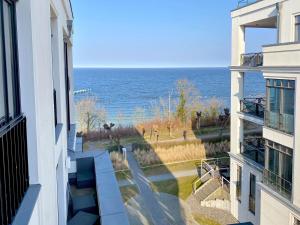a view of the ocean from a building at Villa Philine - Apt. 27 Arwen in Ostseebad Sellin