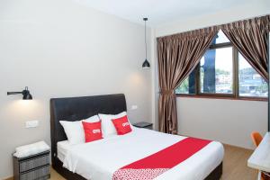 Postel nebo postele na pokoji v ubytování Capital O 90406 Mirani Hotel