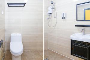 Koupelna v ubytování Capital O 90406 Mirani Hotel