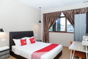 Postel nebo postele na pokoji v ubytování Capital O 90406 Mirani Hotel