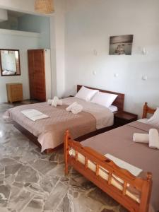 Ένα ή περισσότερα κρεβάτια σε δωμάτιο στο Natalie rooms 2 plaka drepano Ευρύχωρο και δροσερό