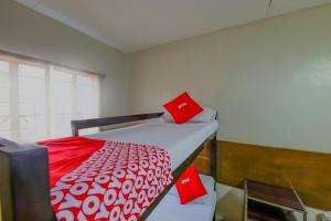 Postel nebo postele na pokoji v ubytování Metro Deluxe Residences