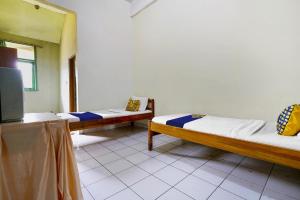 Lova arba lovos apgyvendinimo įstaigoje SPOT ON 91064 Wisma Lec Syariah