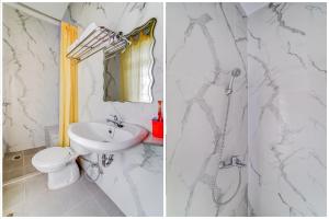 a bathroom with a sink and a toilet and a shower at OYO Homes 91067 Desa Wisata Santanamekar in Rajapolah
