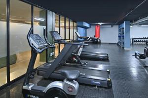 a gym with two treadmills and a treadmill at Circa Aparthotel by Totalstay in Pretoria